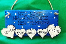 Load image into Gallery viewer, hand painted in blue this rectanglular wall plaque is 6&quot; x 3&quot;. with New home, New adventures, New memories hand written. Family Members names are written in 4cm white hearts and family pets are written on 4cm white paws. white spots pattern can be added to the blue. Hung with jute string twine
