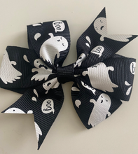 Load image into Gallery viewer, black halloween bow for girls. white ghost pattern
