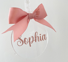 Load image into Gallery viewer, clear acrylic disc with rose gold bow and name. 10cm. hangs with white ribbon
