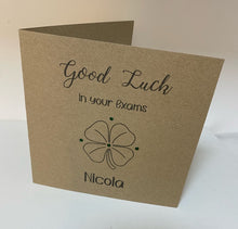 Load image into Gallery viewer, This Card is made from 6&quot; x 6&quot; kraft card. With &quot;Good luck in your exams&quot; printed along the top, a 4 leaf clover in the middle, surrounded by gems and personalised name at the bottom
