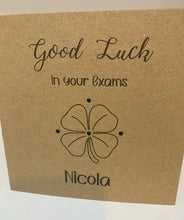 Load image into Gallery viewer, This Card is made from 6&quot; x 6&quot; kraft card. With &quot;Good luck in your exams&quot; printed along the top, a 4 leaf clover in the middle, surrounded by gems and personalised name at the bottom
