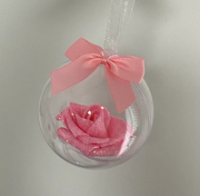 Load image into Gallery viewer, pink glitter covered foam rose is set inside a clear round bauble. tied with jute string and a pink bow sits on top
