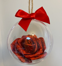 Load image into Gallery viewer, red glitter covered foam rose is set inside a clear round bauble. tied with jute string and a red bow sits on top
