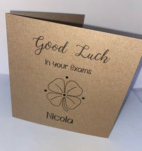 Load image into Gallery viewer, This Card is made from 6&quot; x 6&quot; kraft card. With &quot;Good luck in your exams&quot; printed along the top, a 4 leaf clover in the middle, surrounded by gems and personalised name at the bottom
