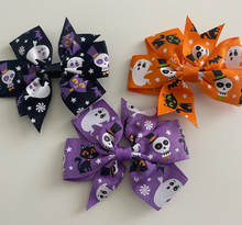 Load image into Gallery viewer, girls halloween hair accessory bow. a pattern of ghosts,skeletons and cats set on either a purple , orange or black bow
