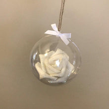 Load image into Gallery viewer, white glitter covered foam rose is set inside a clear round bauble. tied with jute string and a white bow sits on top
