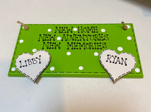 Load image into Gallery viewer, hand painted in lime green this rectanglular wall plaque is 6&quot; x 3&quot;. with New home, New adventures, New memories hand written. Family Members names are written in 4cm white hearts and family pets are written on 4cm white paws. white spots pattern can be added to the lime green. Hung with jute string twine
