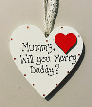 Load image into Gallery viewer, White ceramic heart size 10cm. in the right hand corner a red wooden heart sits  with the hand-wriiten wording &quot;mummy will you marry daddy? filling the rest of the heart. decorated with rhinestone gems sit around the edges
